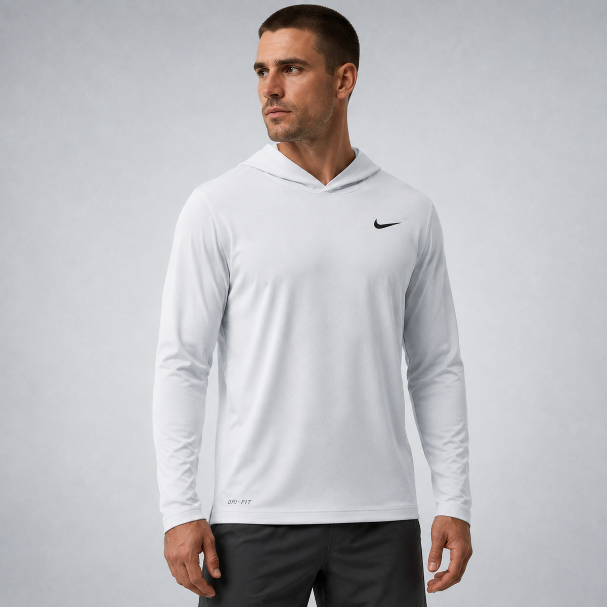 Athletic model wearing the FCTR Apparel Nike Lightweight Hooded Top