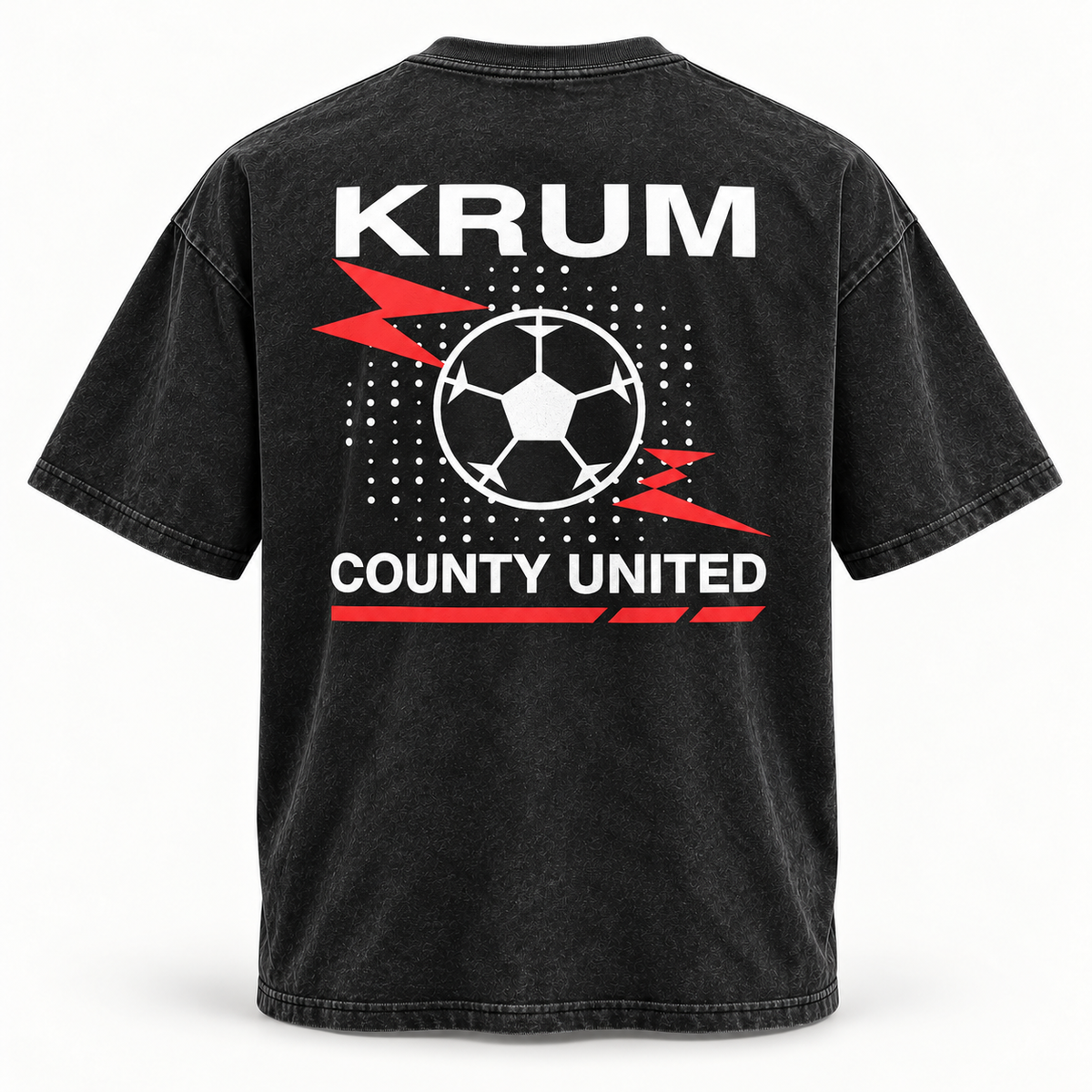 Back of the washed black Krum County United tee with a large red and white soccer-ball burst graphic.